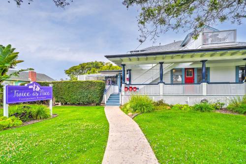 a house with a sign in front of a yard at Cozy Carpinteria Apartment Walkable Location in Carpinteria
