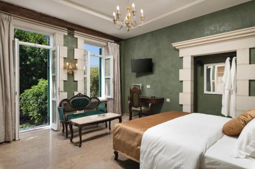 Postel nebo postele na pokoji v ubytování Nobili Boutique Hotel