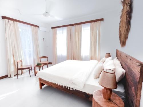 Ένα ή περισσότερα κρεβάτια σε δωμάτιο στο Coco Rise Villas - by Hostly