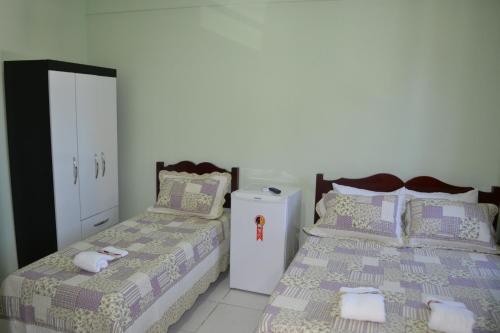 Katil atau katil-katil dalam bilik di Palace Hotel Pôr do Sol