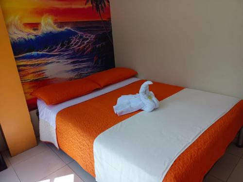 Кровать или кровати в номере Hostal Bryana Inn Baños