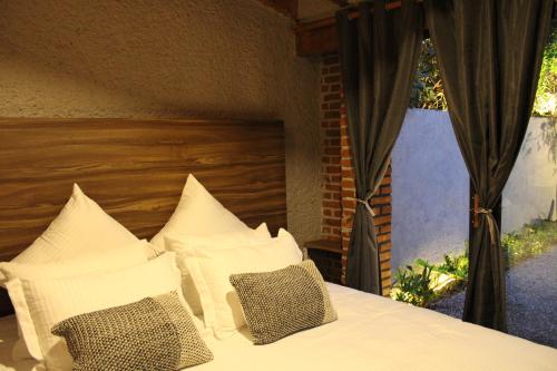Ένα ή περισσότερα κρεβάτια σε δωμάτιο στο Orgánico Hotel Boutique TEPOZTLÁN