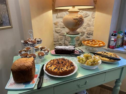 a table topped with lots of different types of cakes and pastries at Il Borgo Antico in Rocca Massima