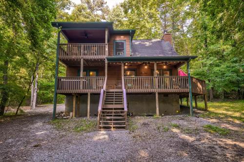 a large house with a staircase leading up to it at Lazy Bear Cabin in Epworth