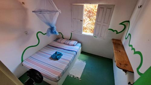 Cama ou camas em um quarto em Natural Hostel Atins