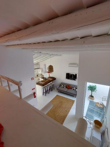 a view of a living room and dining room at Casa Coral in São Marcos do Campo