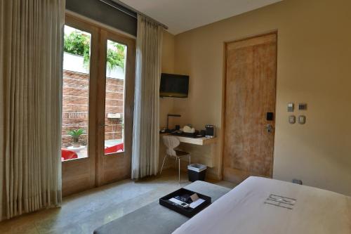 Postel nebo postele na pokoji v ubytování Billini Hotel, Historic Luxury