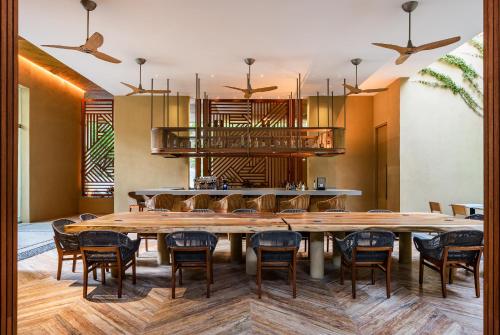 a large dining room with a large table and chairs at Delta Hotels by Marriott Riviera Nayarit, an All-Inclusive Resort in Cruz de Huanacaxtle