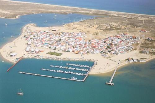 an aerial view of a marina with boats in the water at Sirius - Boat House in Olhão