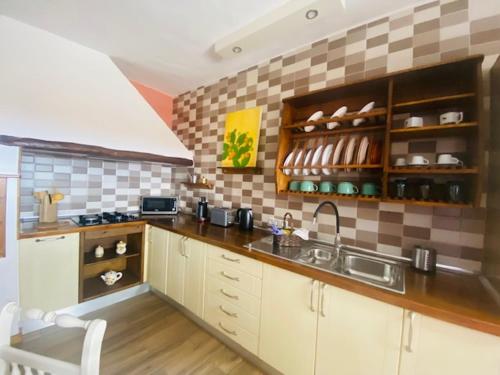 a kitchen with a sink and a counter top at La Pradera in Antigua