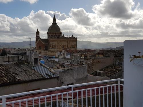 a view of a city with a building in the background at Casa Lupita in Favara