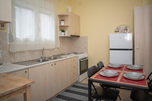 a kitchen with a table with plates on it at Santa Marina in Ioannina