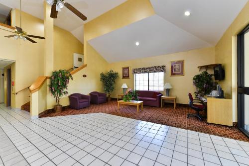 a lobby with purple chairs and a waiting room at America's Best Value Inn & Suites, Atlanta - Morrow in Morrow