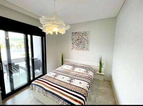 A bed or beds in a room at Luxury Apartment Nikiti Olea Valley