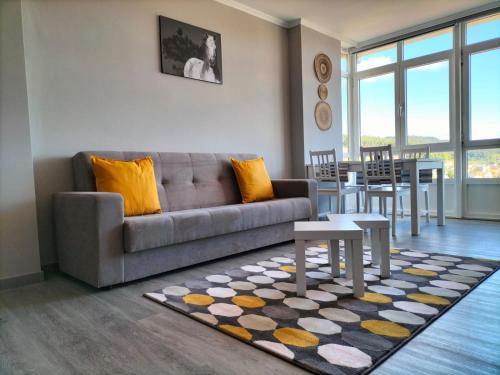 a living room with a couch and a table at O Vendaval in Corcubión