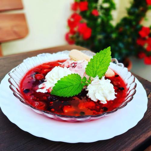 a dessert in a glass bowl on a table at Reiterhof Schmidt, Gaststätte & Pension in Golk