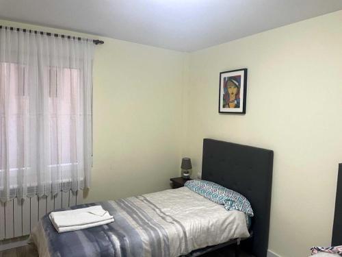 Posteľ alebo postele v izbe v ubytovaní Apartamento Turístico Ávila VUT