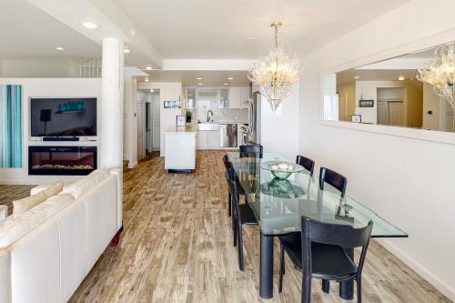 a dining room and living room with a glass table and chairs at Oceanview Paradise in Watsonville