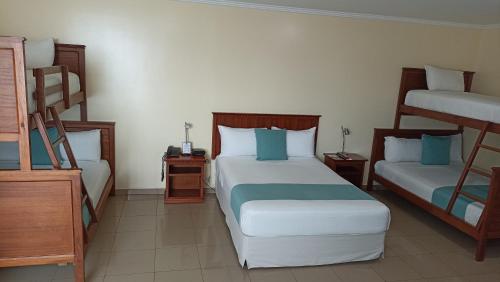 Ένα ή περισσότερα κρεβάτια σε δωμάτιο στο Hotel El Marqués