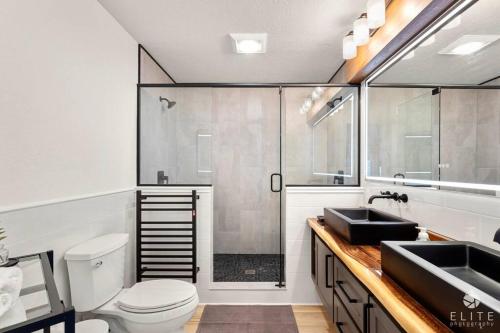 a bathroom with a shower and a toilet and a sink at Luxury Living at The Eagles Perch Palmer AK in Palmer