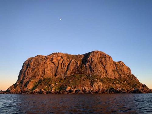 an island in the middle of the water at Stanley Beach House with Stunning Nut Views! in Stanley