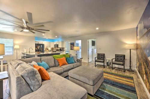 a living room with a couch and a table at Pet-Friendly Digs with Fire Pit and Large Yard! in Fayetteville