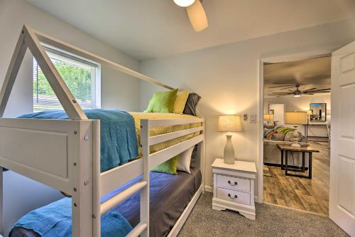 a bedroom with a bunk bed and a mirror at Pet-Friendly Digs with Fire Pit and Large Yard! in Fayetteville
