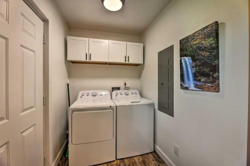 a small laundry room with a washer and dryer at Pet-Friendly Digs with Fire Pit and Large Yard! in Fayetteville