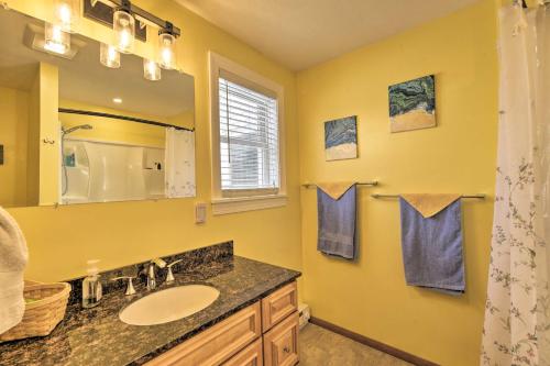 a bathroom with a sink and a mirror at Cozy Getaway - 10 Miles to Mount Wachusett Skiing! in Leominster