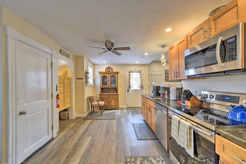 a kitchen with wooden floors and a ceiling fan at Cozy Getaway - 10 Miles to Mount Wachusett Skiing! in Leominster