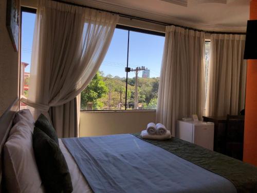 Postel nebo postele na pokoji v ubytování Hotel del Parque