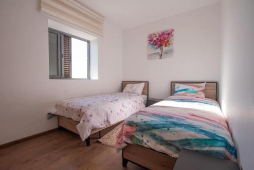 En eller flere senge i et værelse på Blu paradise,a ray of sunshine between sea & pool