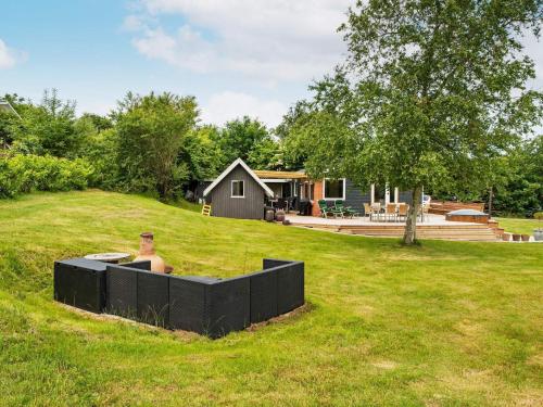 a yard with a house in the background at 8 person holiday home in Struer-By Traum in Struer