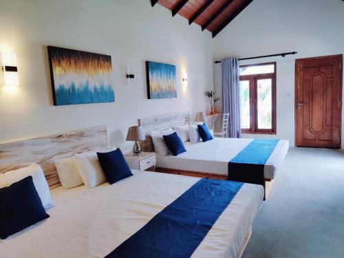 Postel nebo postele na pokoji v ubytování Anukama Resort