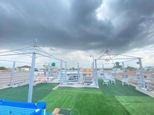 a stadium with chairs and tables on a field at Santiago City Center Huge nice Apartment to stay rooftop to enjoy the city view in Santiago de los Caballeros