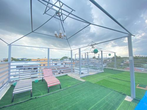 a baseball stadium with two chairs on a field at Santiago City Center Huge nice Apartment to stay rooftop to enjoy the city view in Santiago de los Caballeros
