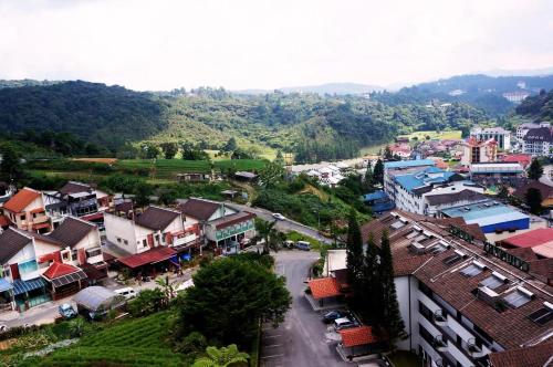 an aerial view of a town with houses and a street at Cameron View Apartment @ Crown Imperial Court Brinchang in Cameron Highlands