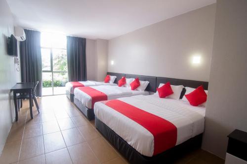 Ένα ή περισσότερα κρεβάτια σε δωμάτιο στο Super OYO 897 iBC36 Business Stay