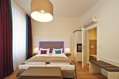 Katil atau katil-katil dalam bilik di Hotel Elch Boutique