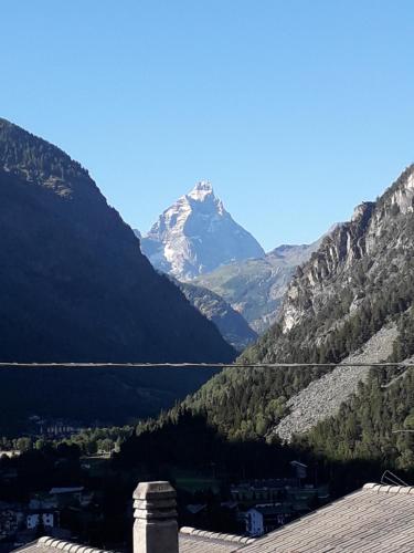 a mountain in the middle of a valley at The Green Owl in Antey-Saint-André