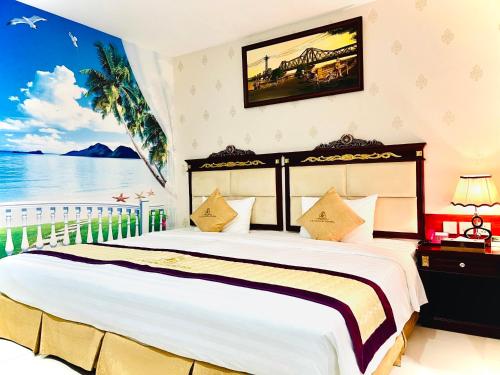 a bedroom with a large bed with a view of the ocean at Le Saigon Hotel in Ho Chi Minh City