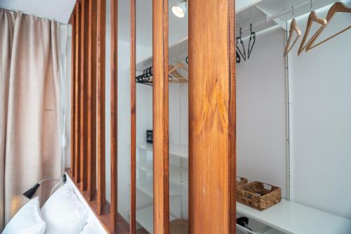 a dressing room with a mirror and a bed at Sun and Sea Deluxe Apartments in Split