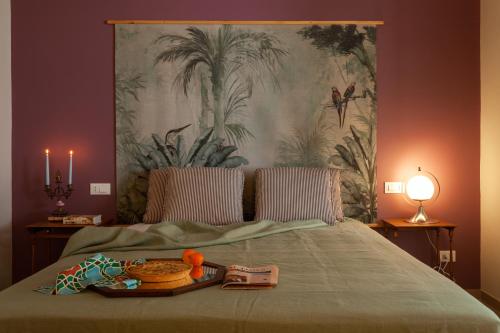 A bed or beds in a room at Frangimare La Segreta