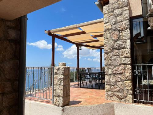 a patio with a view of the ocean at Family Villa Tiffany&more in Barić Draga
