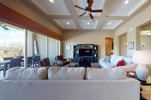 a living room with a couch and a table at Dove Mountain Dream in Marana