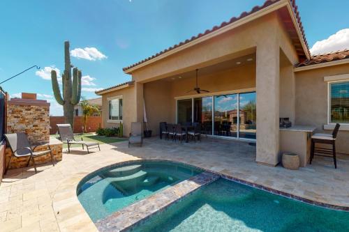 a backyard with a swimming pool and a house at Dove Mountain Dream in Marana