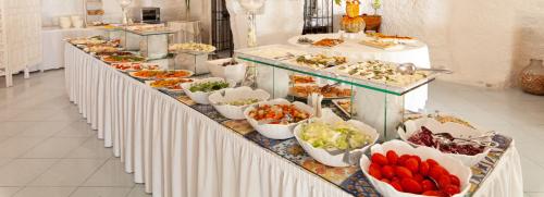 a buffet line with many different types of food at Paradiso Terme Resort & SPA con 5 piscine termali in Ischia