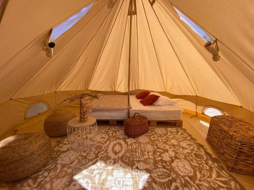 a room with a tent with a bed in it at Tente évasion in Tuchan