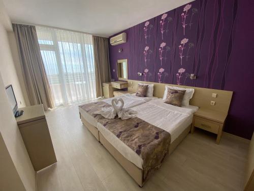Krevet ili kreveti u jedinici u okviru objekta Hotel Ancora Beach