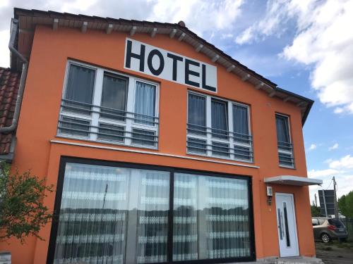 a hotel sign on the side of a building at la casa mia in Bad Langensalza
